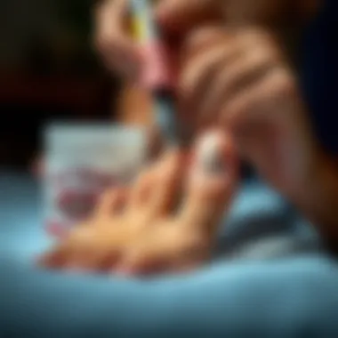 Applying Topical Treatment to Toenail Person applying topical treatment to a toenail