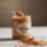 A close-up of a peanut butter jar with a spoon, showcasing its creamy texture.