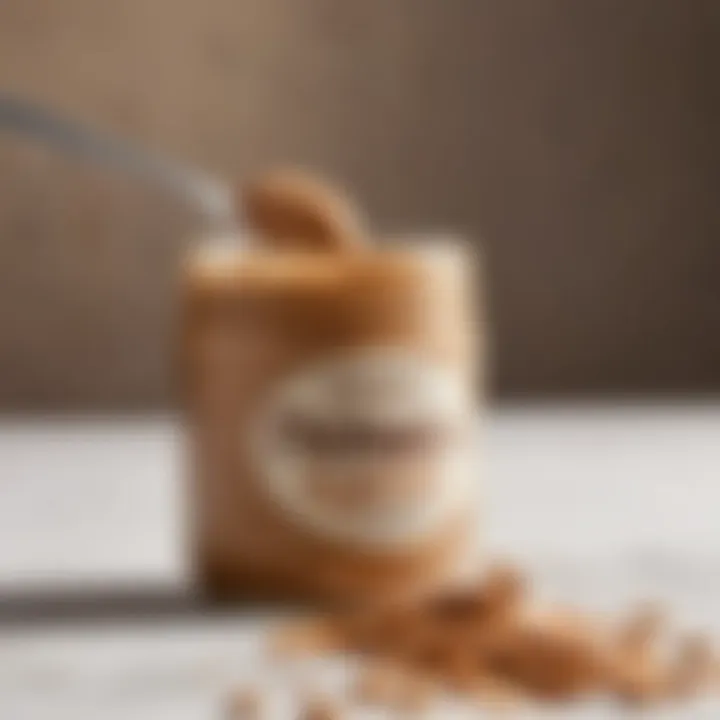 A close-up of a peanut butter jar with a spoon, showcasing its creamy texture.