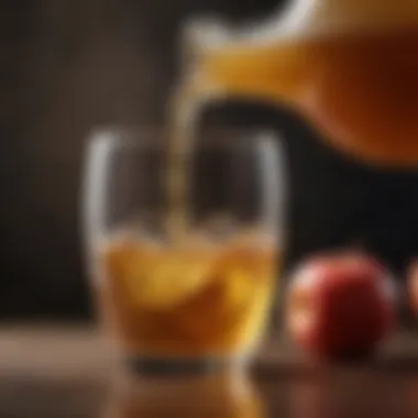 A close-up of apple cider vinegar being poured into a glass