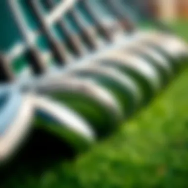 Different types of golf clubs arranged in a row