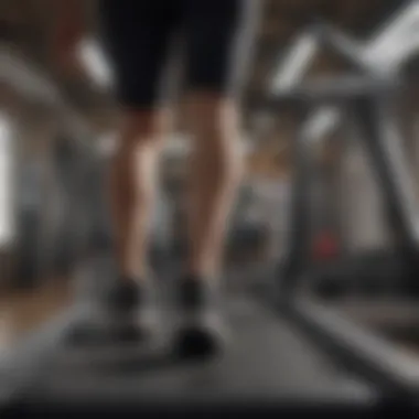 Person adjusting settings on a treadmill for an optimal workout