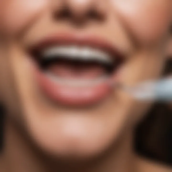 Person applying a teeth whitening treatment at home