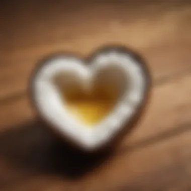 A heart shape formed with coconut oil on a wooden surface