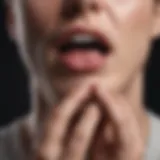 Close-up of a person holding their throat, indicating discomfort.